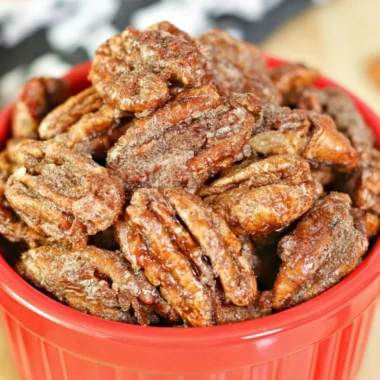 Air fryer candied pecans in a bowl, perfect for snacks and desserts