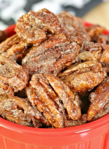 Air fryer candied pecans in a bowl, perfect for snacks and desserts