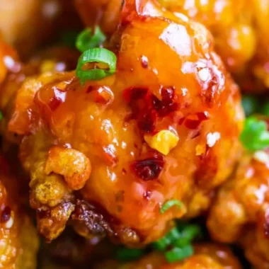 Delicious Asian Sweet Chili Chicken served with rice and vegetables