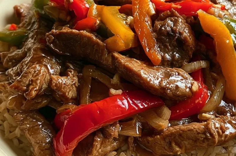 Cozy slow cooker pepper steak dish served with vegetables