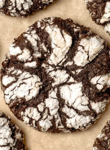 Freshly baked chocolate crinkle cookies coated in powdered sugar