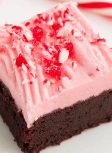 Delicious Candy Cane Brownies topped with festive crushed candy canes for Christmas.