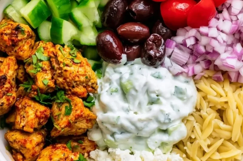 High-protein chicken gyro bowl with fresh vegetables and sauce