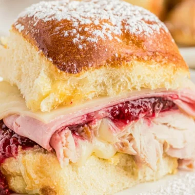 Delicious Easy Cheesy Monte Cristo Sliders served on a platter.