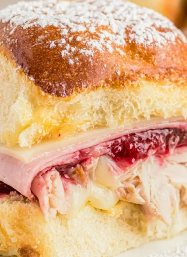 Delicious Easy Cheesy Monte Cristo Sliders served on a platter.
