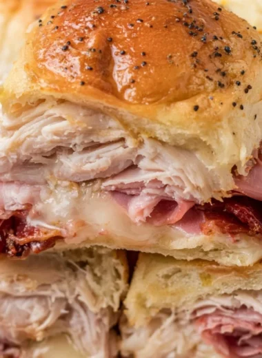 Delicious buttery baked club sliders served on a platter