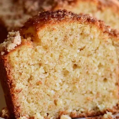 Delicious spiced eggnog loaf displayed on a festive table.