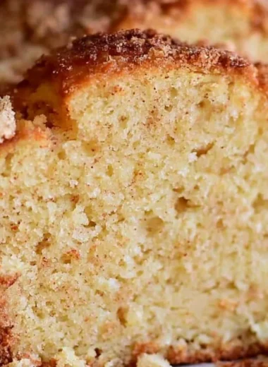 Delicious spiced eggnog loaf displayed on a festive table.