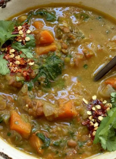 Delicious Sweet Potato Lentil Stew served in a bowl with fresh herbs