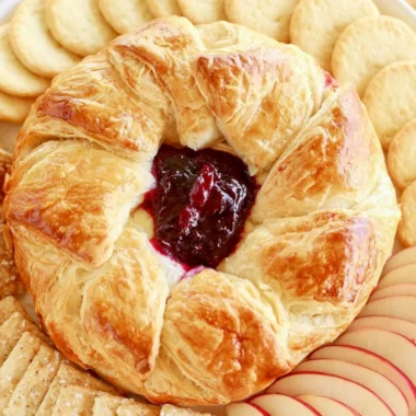 Delicious baked brie in puff pastry served on a platter
